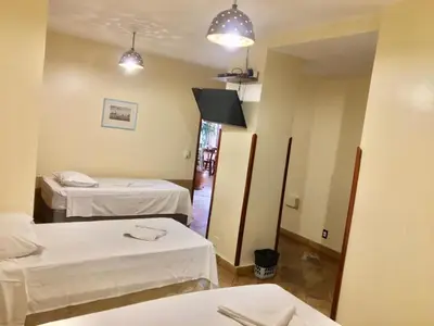 Uma cama ou camas num quarto em Pousada Fortal Villa Praia