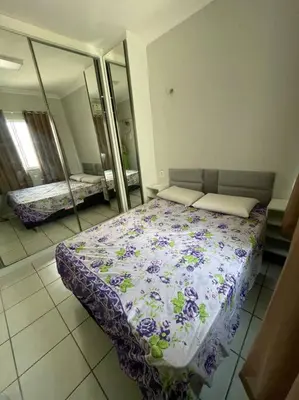 Uma cama ou camas num quarto em Apartamento próximo ao aeroporto