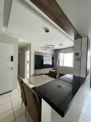 Uma televisão e/ou sistema de entretenimento em Apartamento próximo ao aeroporto