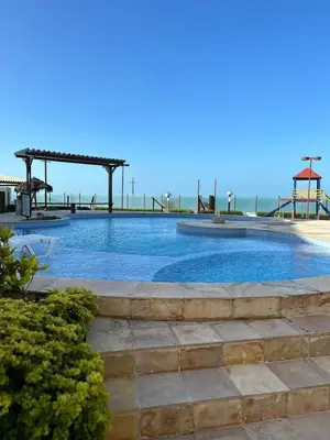A piscina em ou perto de Apto 2 quartos - Condomínio Frente Mar