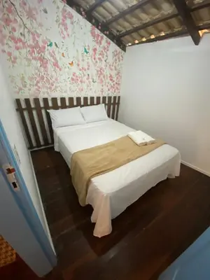 Uma cama ou camas num quarto em Apartamento Charme Guará - Na Praça de Guaramiranga