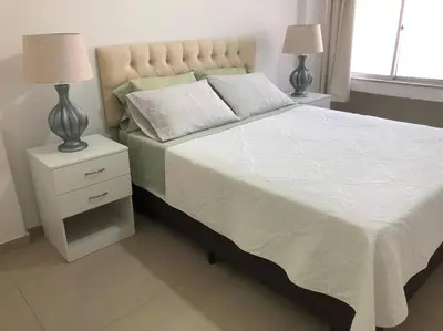 Uma cama ou camas num quarto em Cozy apartment by the ocean