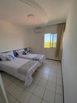Uma cama ou camas num quarto em Apartamento Praia do Futuro, 4qtos,300ms da praia