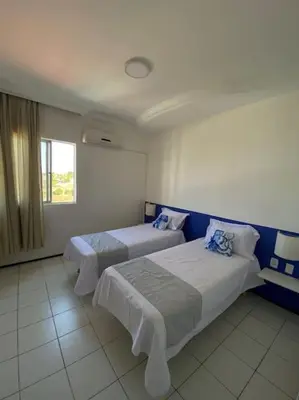 Uma cama ou camas num quarto em Apartamento Praia do Futuro, 4qtos,300ms da praia