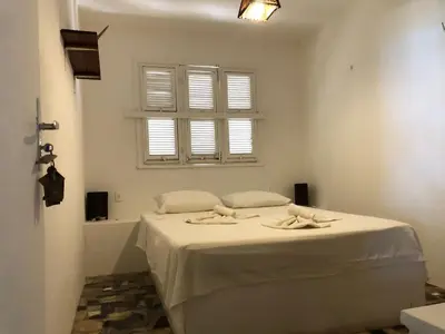 Uma cama ou camas num quarto em ITACUPA - Pousada & Foil Center