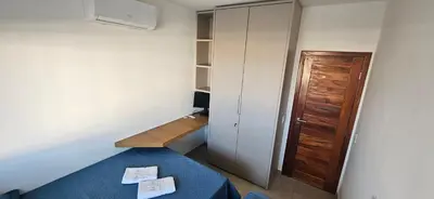 Uma cama ou camas num quarto em Condominio Boas Vistas