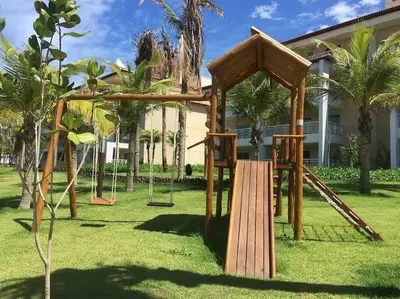 Um jardim no exterior de Golf Ville Resort Residence Bloco 64mar Apto 31 Aquiraz - Ceara - Brasil
