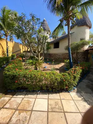 Um jardim no exterior de Pousada Capitólio 04 Canoa Quebrada