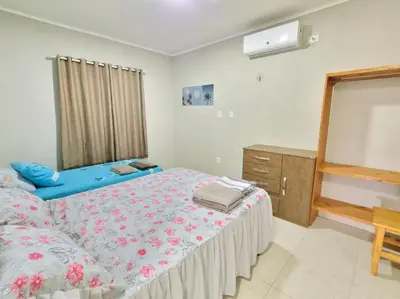 Uma cama ou camas num quarto em Beach House Preá