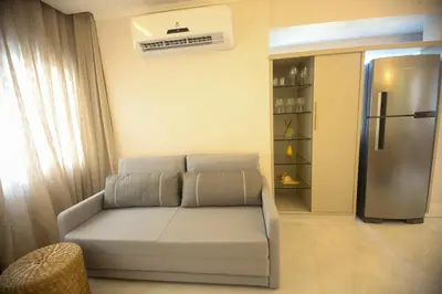 Uma área de estar em Flat Beira Mar