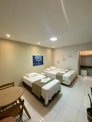 Uma cama ou camas num quarto em Suítes nativa