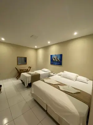 Uma cama ou camas num quarto em Suítes nativa