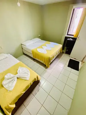 Uma cama ou camas num quarto em Felicità Praia Hotel