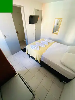 Uma cama ou camas num quarto em Felicità Praia Hotel