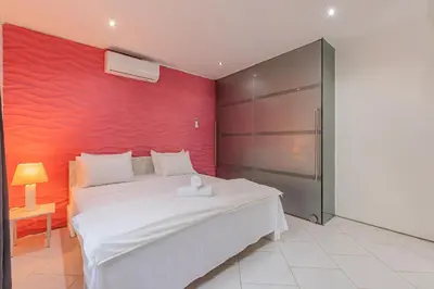 Uma cama ou camas num quarto em Casa com Piscina em Porto das Dunas by Carpediem