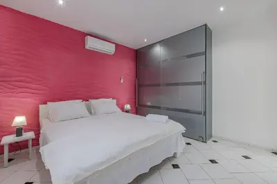 Uma cama ou camas num quarto em Casa com Piscina em Porto das Dunas by Carpediem
