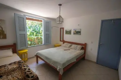 Uma cama ou camas num quarto em Tranquilidade e Conforto em Guaramiranga