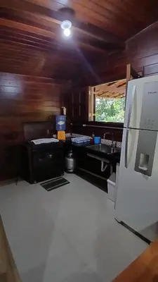 A cozinha ou kitchenette de Casa de madeira A 6km de Guaramiranga