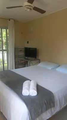Uma cama ou camas num quarto em Pousada Rota Do Beija Flor PACOTI-CE