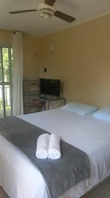 Uma cama ou camas num quarto em Pousada Rota Do Beija Flor PACOTI-CE