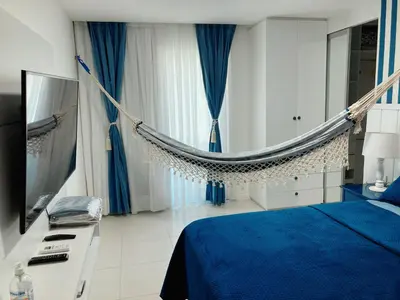 Uma cama ou camas num quarto em Ap 3 suítes Nascente Golfville Resort próx Beach Park