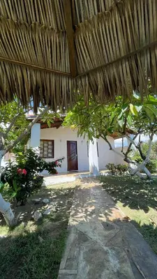 Um jardim no exterior de Pousada Velas de Flecheiras