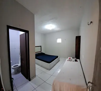 Uma cama ou camas num quarto em Pousada leblon