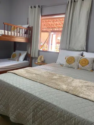 Uma cama ou camas num quarto em Casa com Piscina Privativa - Perto da Lagoa do Paraíso