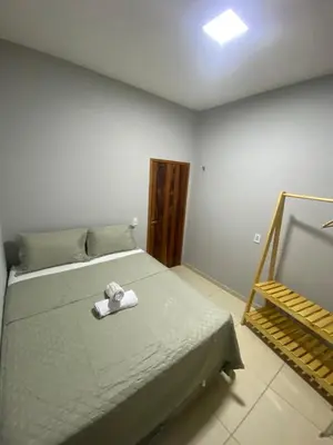 Uma cama ou camas num quarto em Casa com Piscina Privativa - Perto da Lagoa do Paraíso