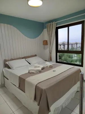 Uma cama ou camas num quarto em VG Sun Cumbuco 406