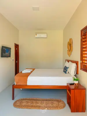 Uma cama ou camas num quarto em Casa Zoe Icaraizinho