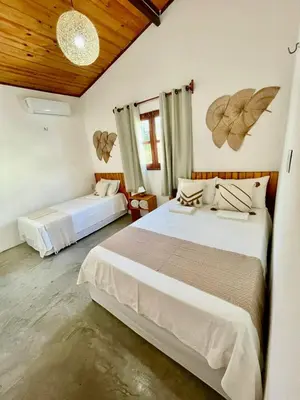 Uma cama ou camas num quarto em Casa Ariacó