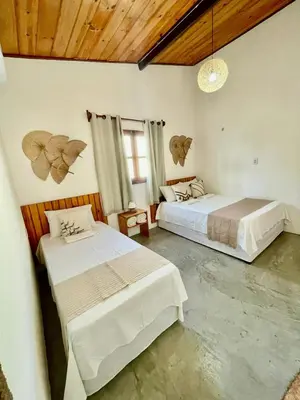 Uma cama ou camas num quarto em Casa Ariacó