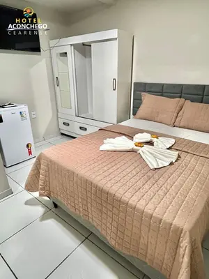 Uma cama ou camas num quarto em Hotel Aconchego Cearense