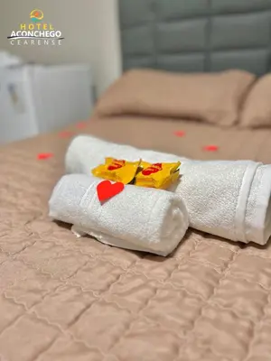 Uma cama ou camas num quarto em Hotel Aconchego Cearense
