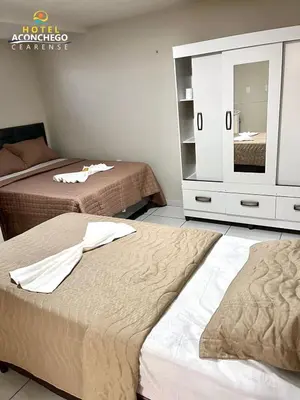 Uma cama ou camas num quarto em Hotel Aconchego Cearense