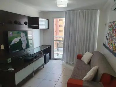 Uma televisão e/ou sistema de entretenimento em Ed Terraço Atlantico 1011 lateral vista mar