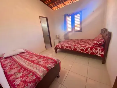 Uma cama ou camas num quarto em Casa de Praia Em Aguas Belas 3 suites