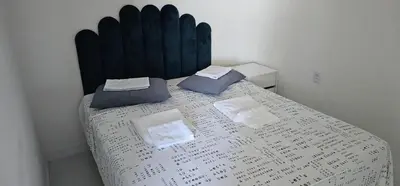 Uma cama ou camas num quarto em Apart vista para o mar da Praia de Iracema