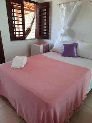 Uma cama ou camas num quarto em Pousada dos Anjos Paracuru