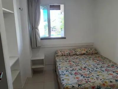 Uma cama ou camas num quarto em Apartamento Porto Beach Residence