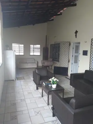 Uma área de estar em Pousada Suítes Meireles