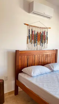Uma cama ou camas num quarto em BRISAS DE FORTIM VILLAGE