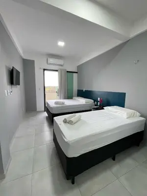 Uma cama ou camas num quarto em HOTEL GATAO