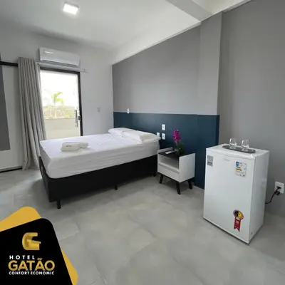 Uma cama ou camas num quarto em HOTEL GATAO