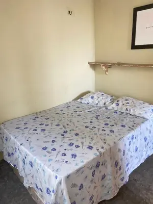 Uma cama ou camas num quarto em Casa do Charlles