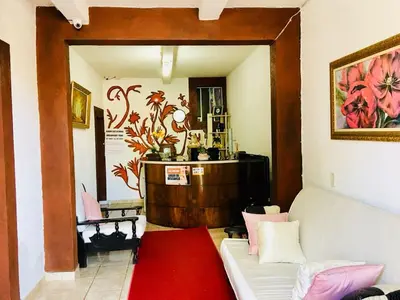 Uma área de estar em Pousada Brenda