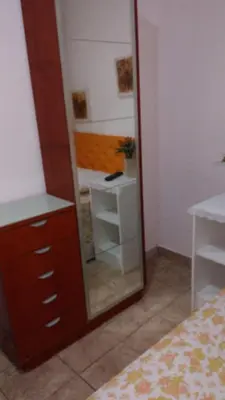 Uma cama ou camas num quarto em Pousada Brenda