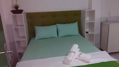 Uma cama ou camas num quarto em Pousada Brenda