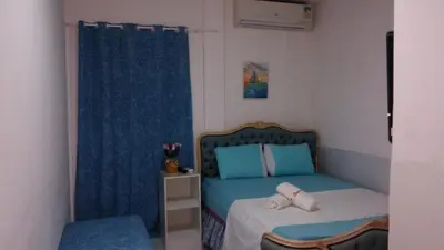 Uma cama ou camas num quarto em Pousada Brenda